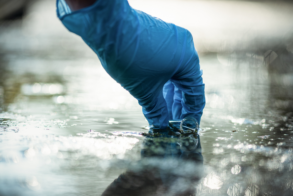 Pond,Water,Pollution,Concept.,Scientist,Takes,Samples,Of,Dirty,Water